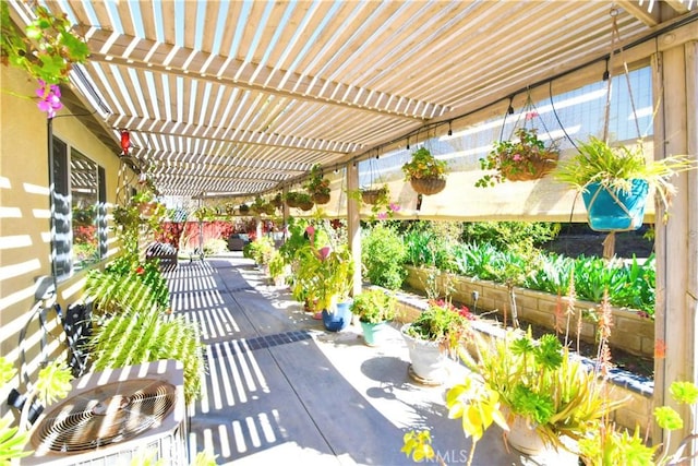 view of patio / terrace featuring a pergola and fence