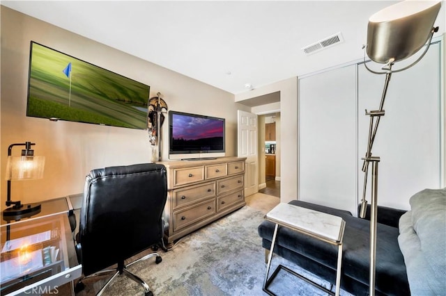 office area featuring light carpet and visible vents