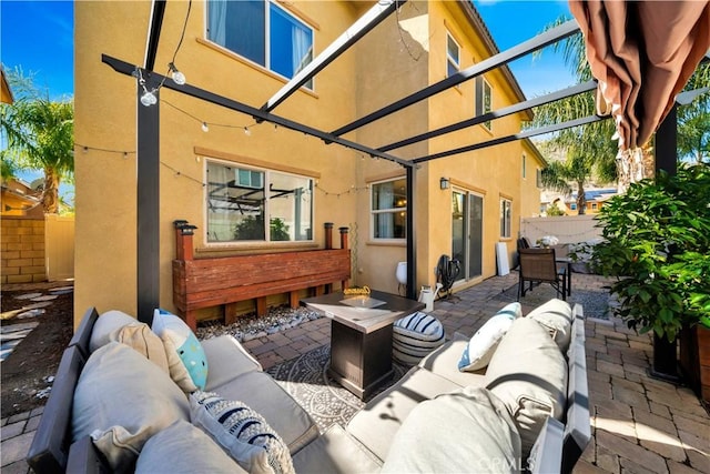 view of patio with an outdoor hangout area and fence