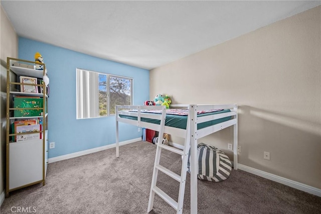 bedroom featuring baseboards and carpet flooring