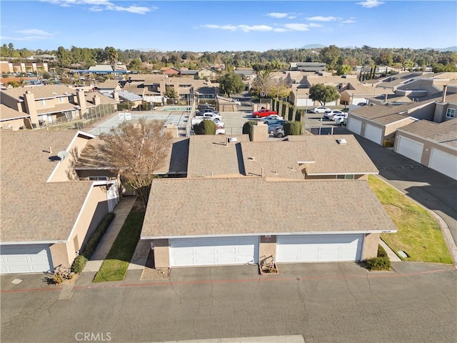 birds eye view of property with a residential view