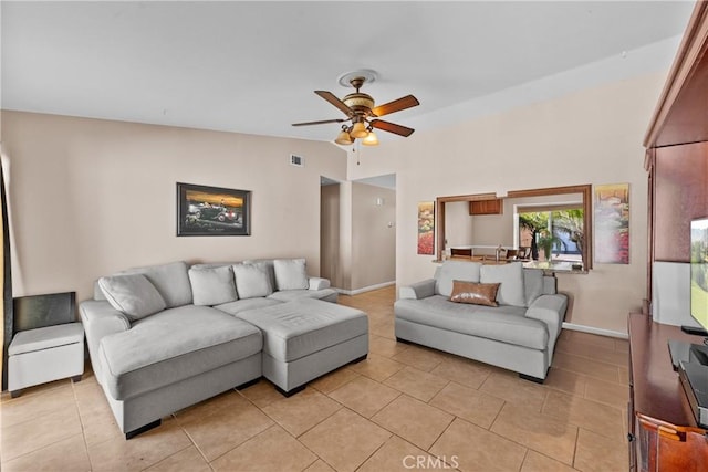 living room with lofted ceiling, light tile patterned floors, visible vents, and a ceiling fan