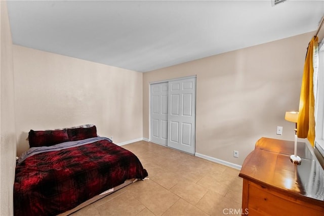 44680 La Paz Rd, Temecula, CA 92592 - bedroom with baseboards, a closet, and light tile patterned floors