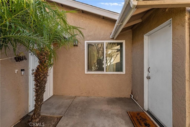 44680 La Paz Rd, Temecula, CA 92592 - view of exterior entry with a patio and stucco siding