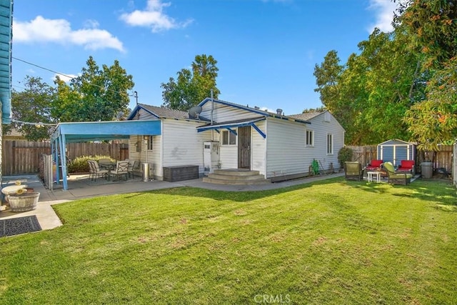 rear view of property with an outbuilding, a patio area, a fenced backyard, and a storage shed