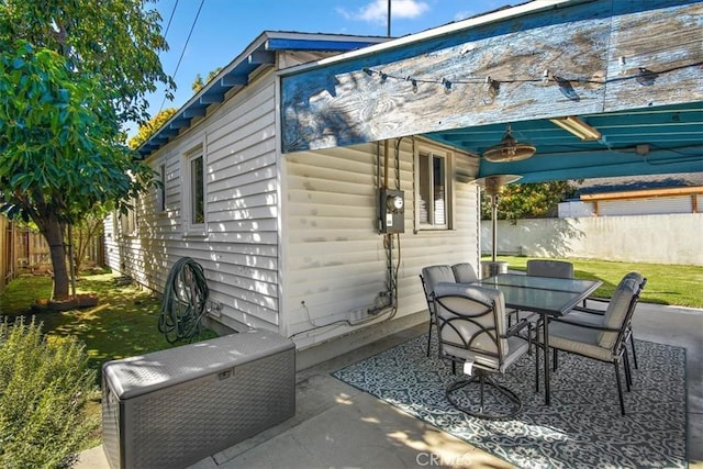 view of patio with a fenced backyard and outdoor dining space