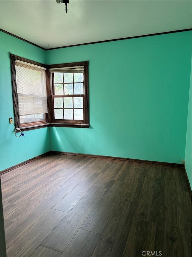 empty room featuring dark wood-type flooring