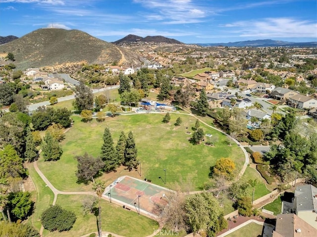 birds eye view of property featuring a mountain view and a residential view