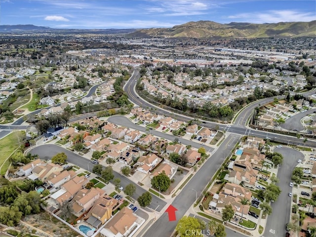 birds eye view of property featuring a mountain view and a residential view