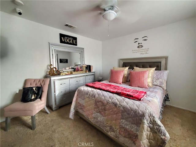 bedroom with visible vents, ceiling fan, and carpet