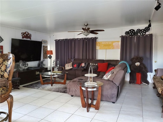 living room featuring ceiling fan and light tile patterned flooring