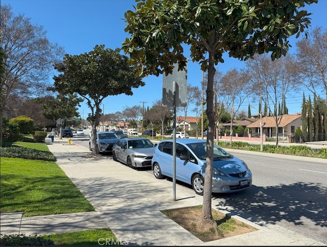 view of street with sidewalks and a residential view