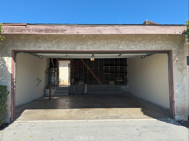 garage with strapped water heater