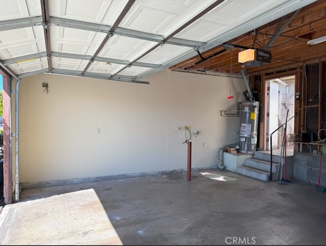 garage featuring water heater and a garage door opener