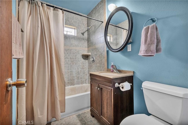 bathroom featuring vanity, toilet, and shower / tub combo