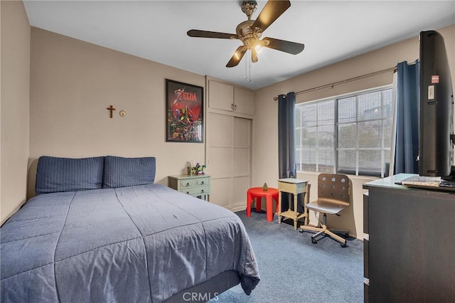 carpeted bedroom with ceiling fan