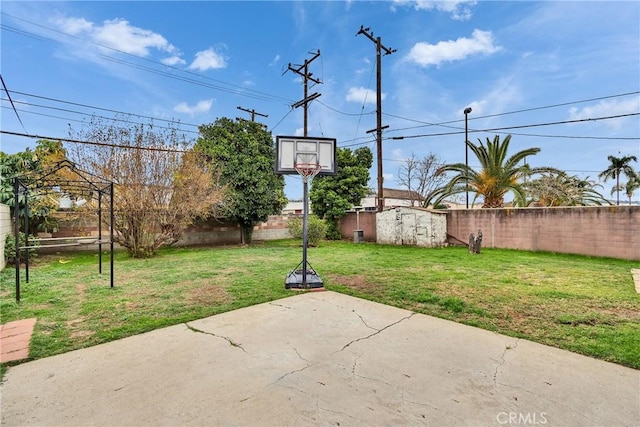 view of patio / terrace with a fenced backyard, a storage shed, and an outdoor structure