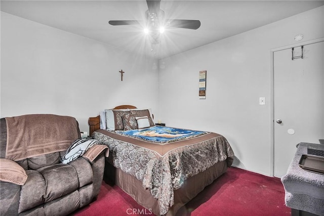 bedroom with a ceiling fan and carpet flooring