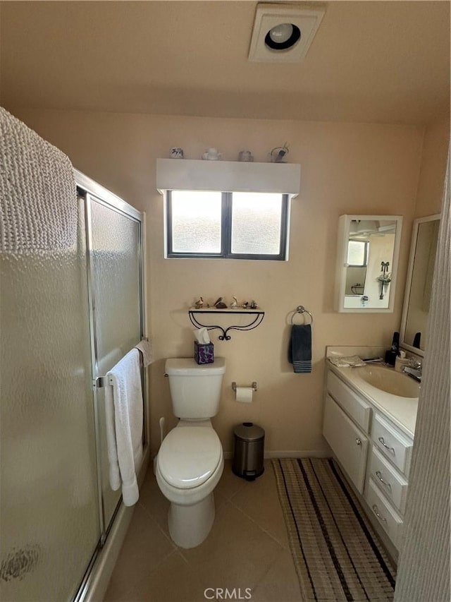 full bath featuring toilet, a stall shower, tile patterned flooring, and vanity