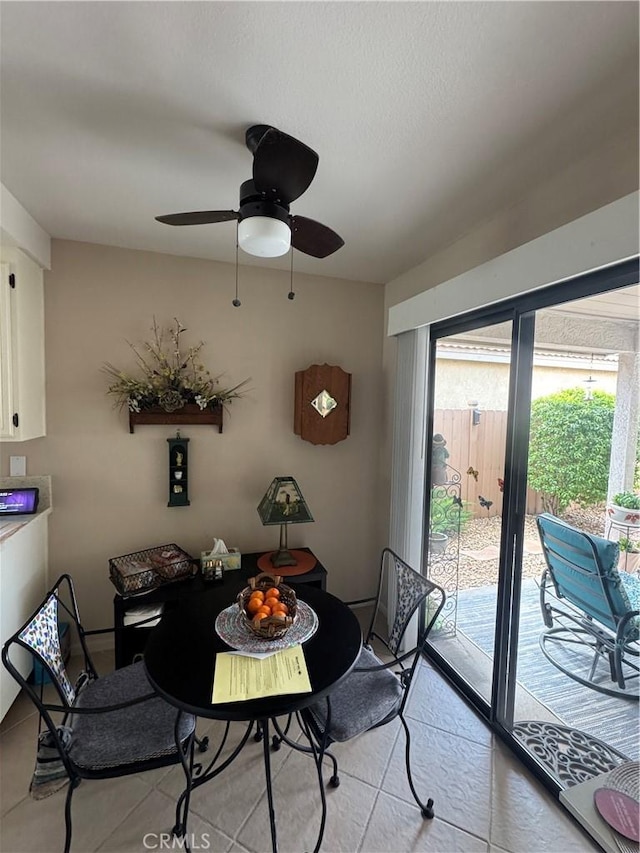 dining room featuring a ceiling fan and light tile patterned floors