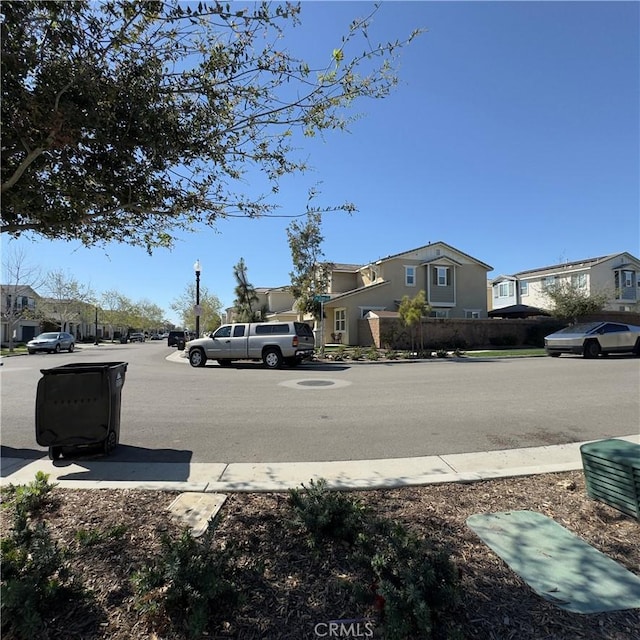 view of street featuring sidewalks and a residential view