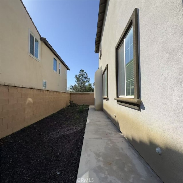 4435 S Zion Trl, Ontario, CA 91762 - view of side of property featuring stucco siding and a fenced backyard