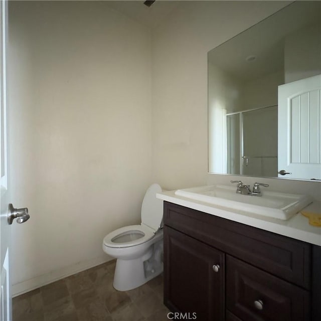 4435 S Zion Trl, Ontario, CA 91762 - bathroom with toilet, an enclosed shower, vanity, and baseboards