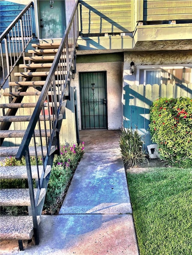 view of exterior entry featuring stucco siding