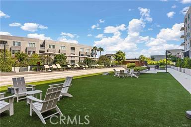 view of property's community with a lawn