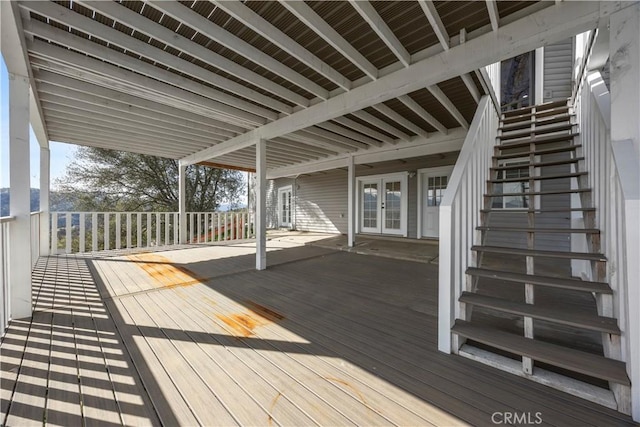 wooden terrace featuring stairs and french doors