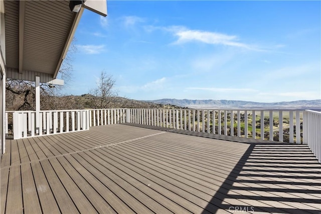 wooden terrace with a mountain view