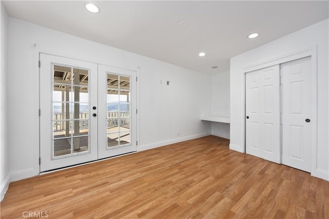 unfurnished bedroom featuring recessed lighting, baseboards, access to outside, french doors, and light wood-type flooring