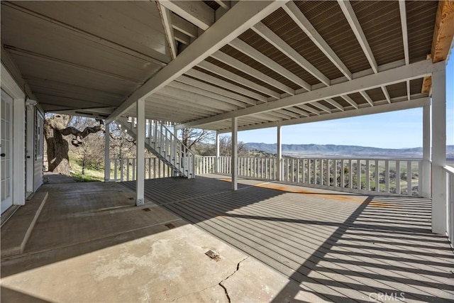 deck featuring stairs and a mountain view