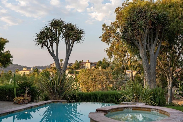 pool with an in ground hot tub