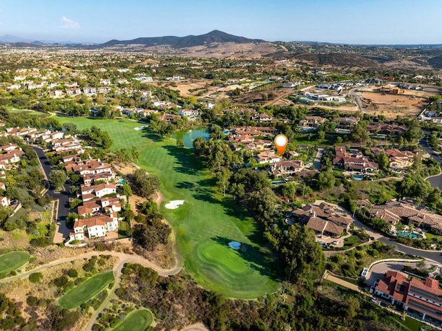 aerial view featuring a residential view, view of golf course, and a mountain view