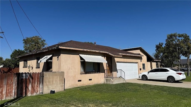 view of side of property featuring driveway, crawl space, an attached garage, fence, and stucco siding