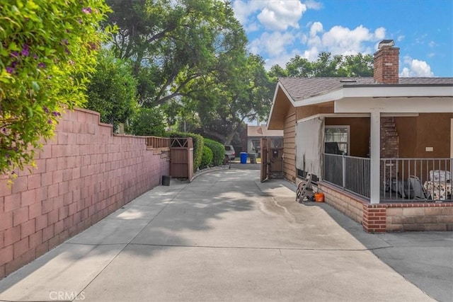 view of patio / terrace featuring fence