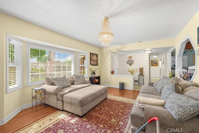 living room featuring wood finished floors and baseboards