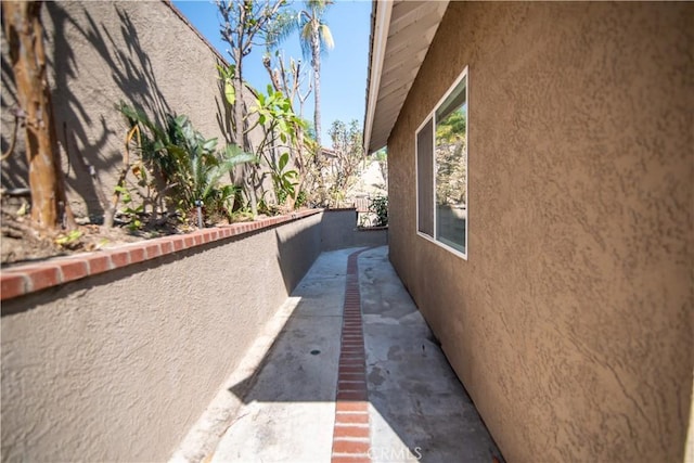 view of side of property with stucco siding