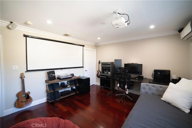 cinema room featuring baseboards, wood finished floors, visible vents, and ornamental molding