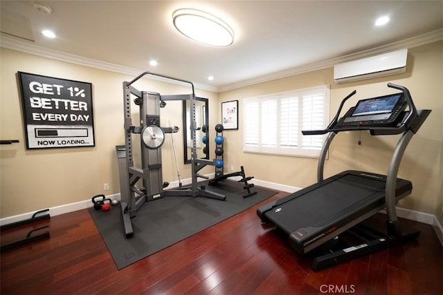 workout area with crown molding, wood finished floors, baseboards, and a wall mounted AC