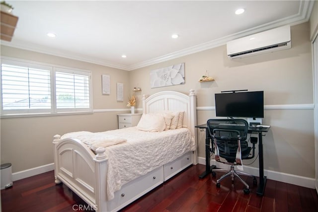 bedroom featuring dark wood finished floors, crown molding, baseboards, and a wall mounted air conditioner