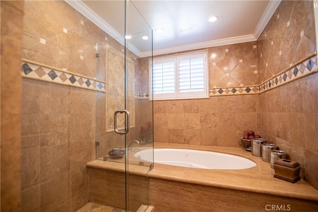 bathroom featuring a stall shower, tile walls, a garden tub, and ornamental molding