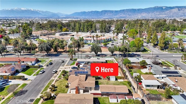 drone / aerial view with a residential view and a mountain view