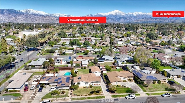 drone / aerial view with a residential view and a mountain view