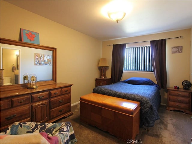 bedroom with dark carpet