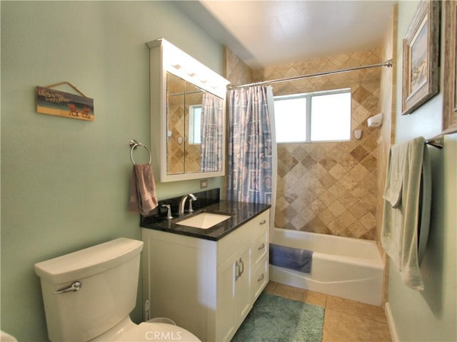 bathroom featuring vanity, shower / bath combo with shower curtain, toilet, and tile patterned floors