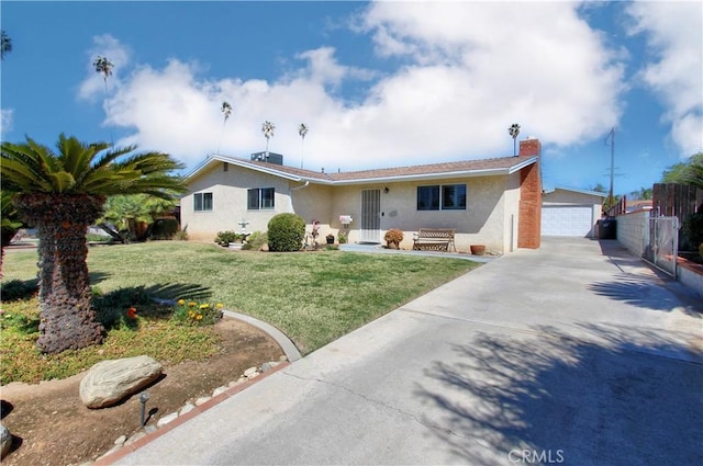 ranch-style house with an outbuilding, a chimney, stucco siding, a garage, and a front lawn