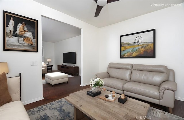 living room with baseboards, dark wood-style flooring, and ceiling fan