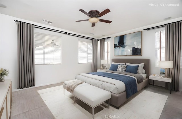 bedroom with visible vents and ceiling fan